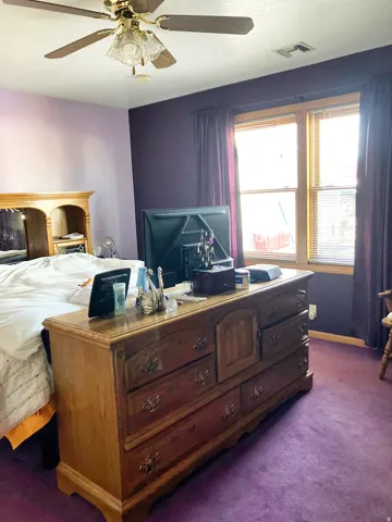 Bedroom featuring carpet flooring and ceiling fan