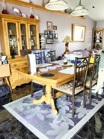 Dining area featuring lofted ceiling