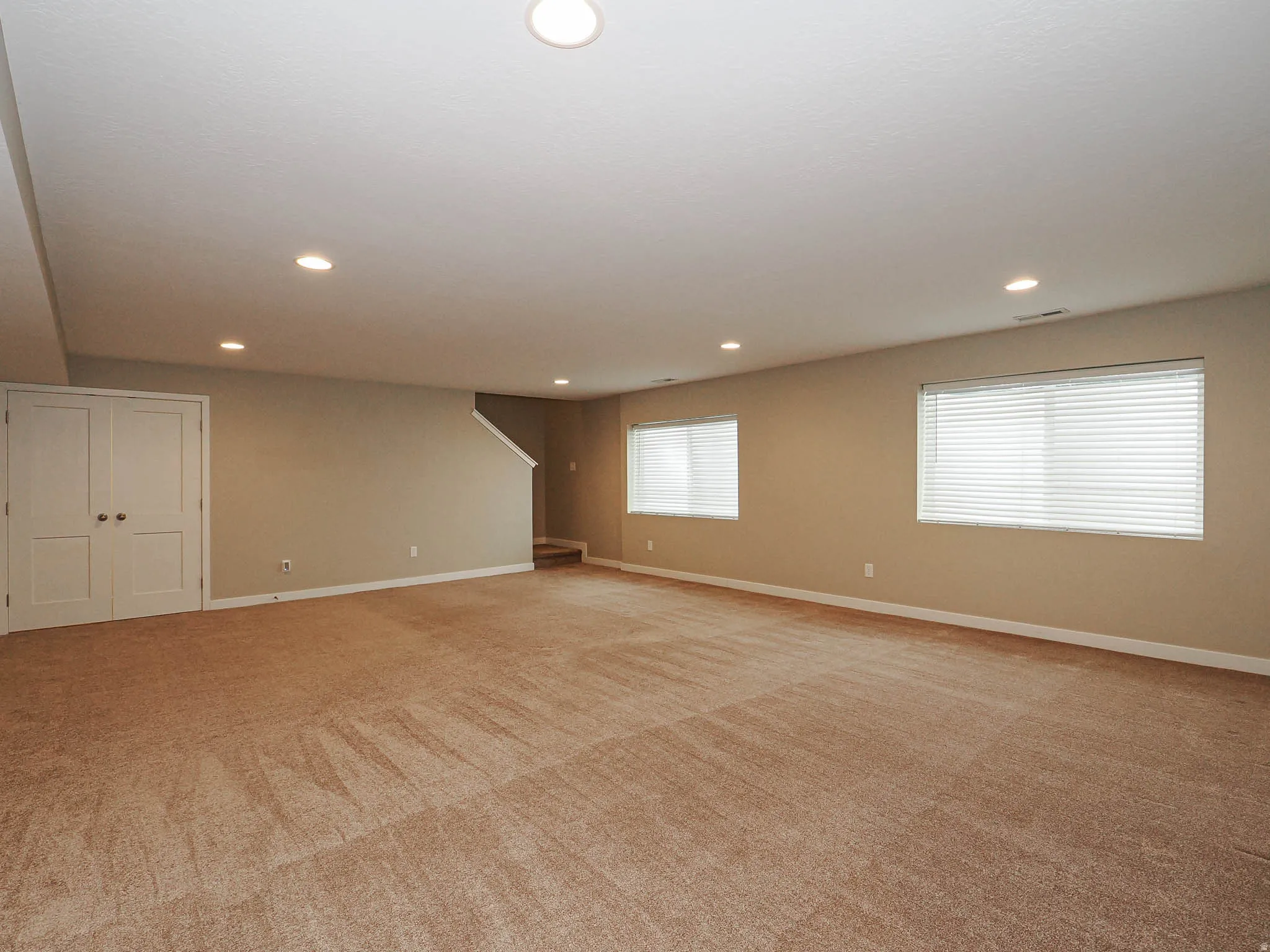 Space for everyone in this huge basement family room