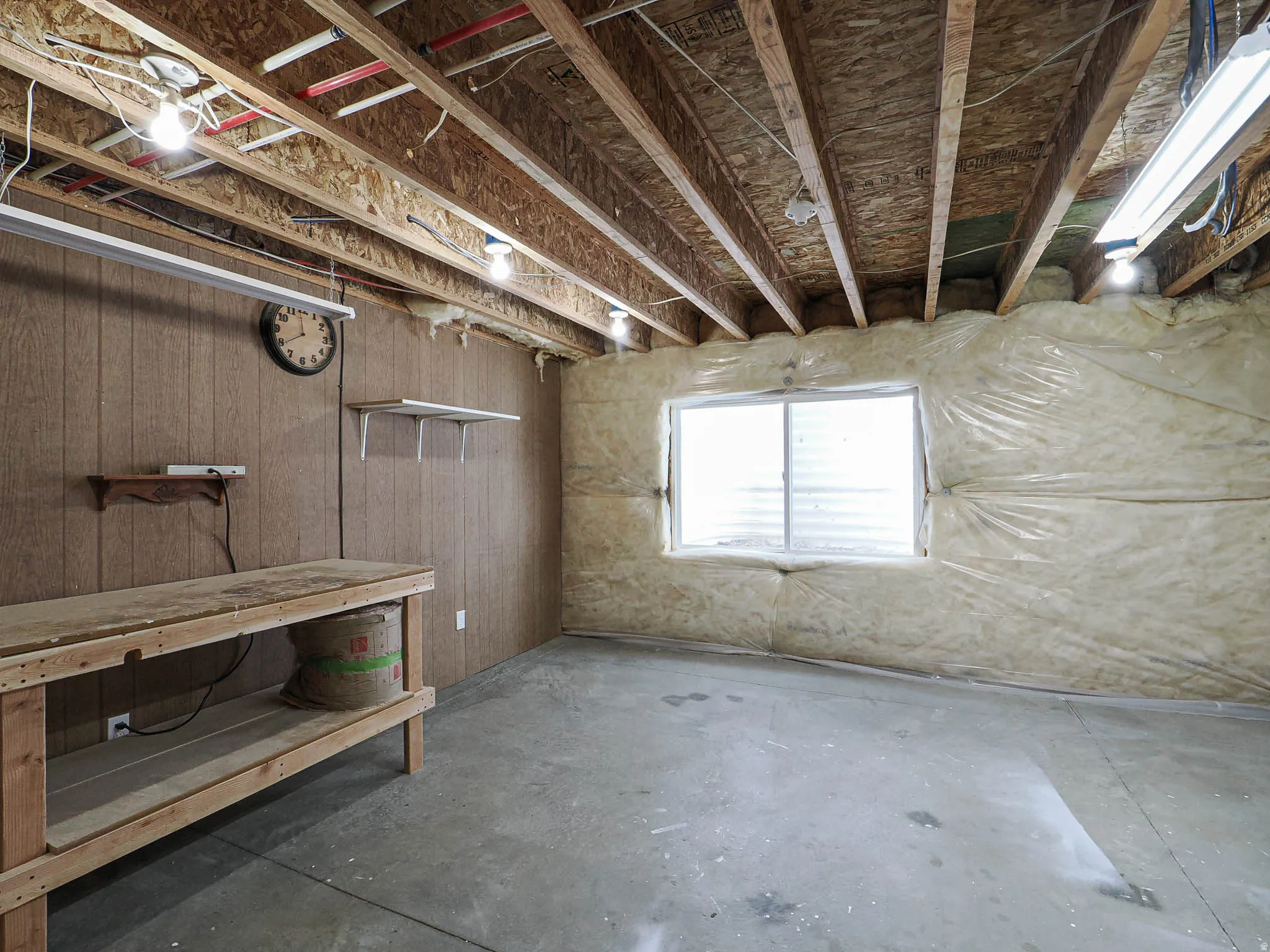 Basement workshop with workbench. Could be 5th bedroom.