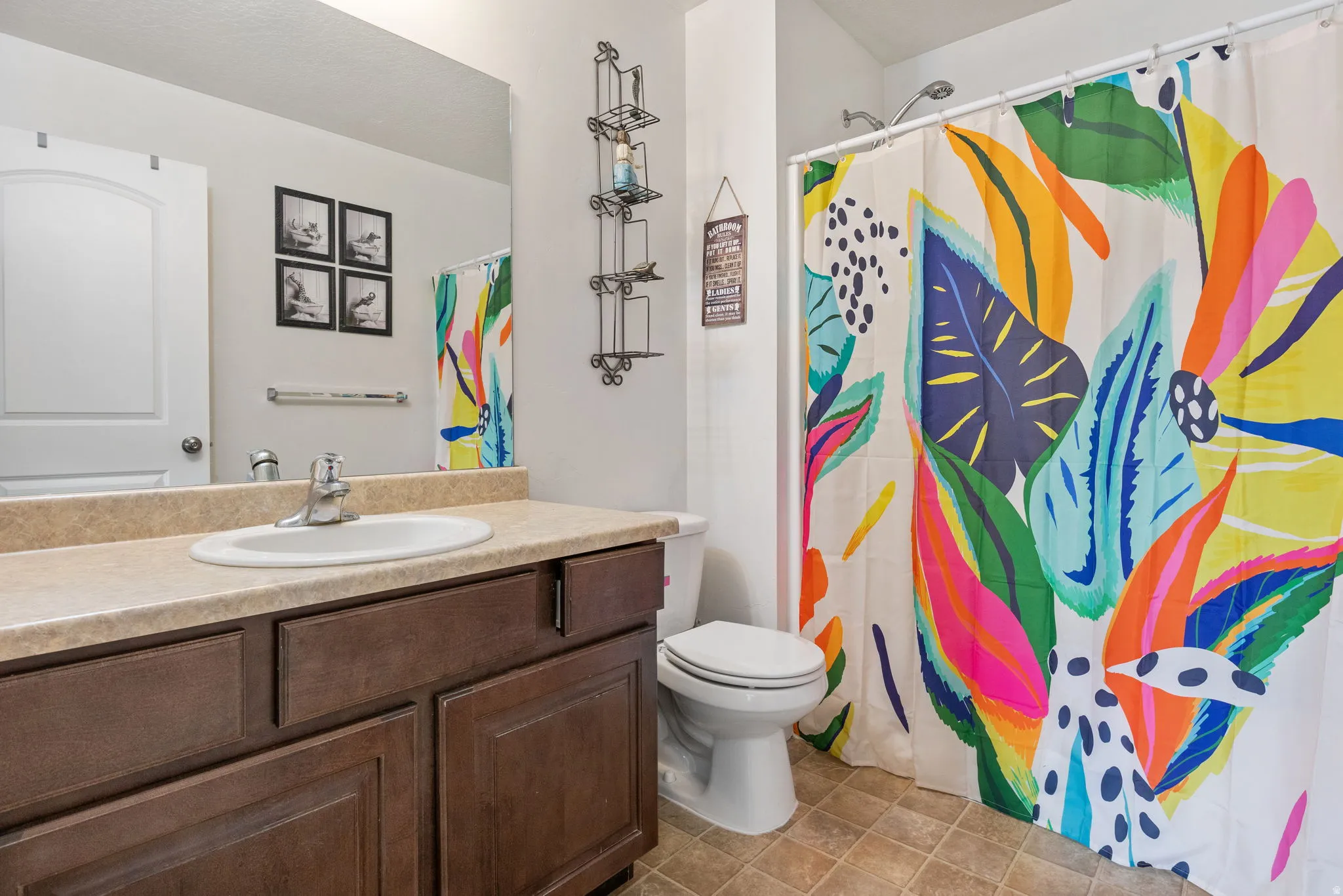 Full bathroom with vanity and curtained shower