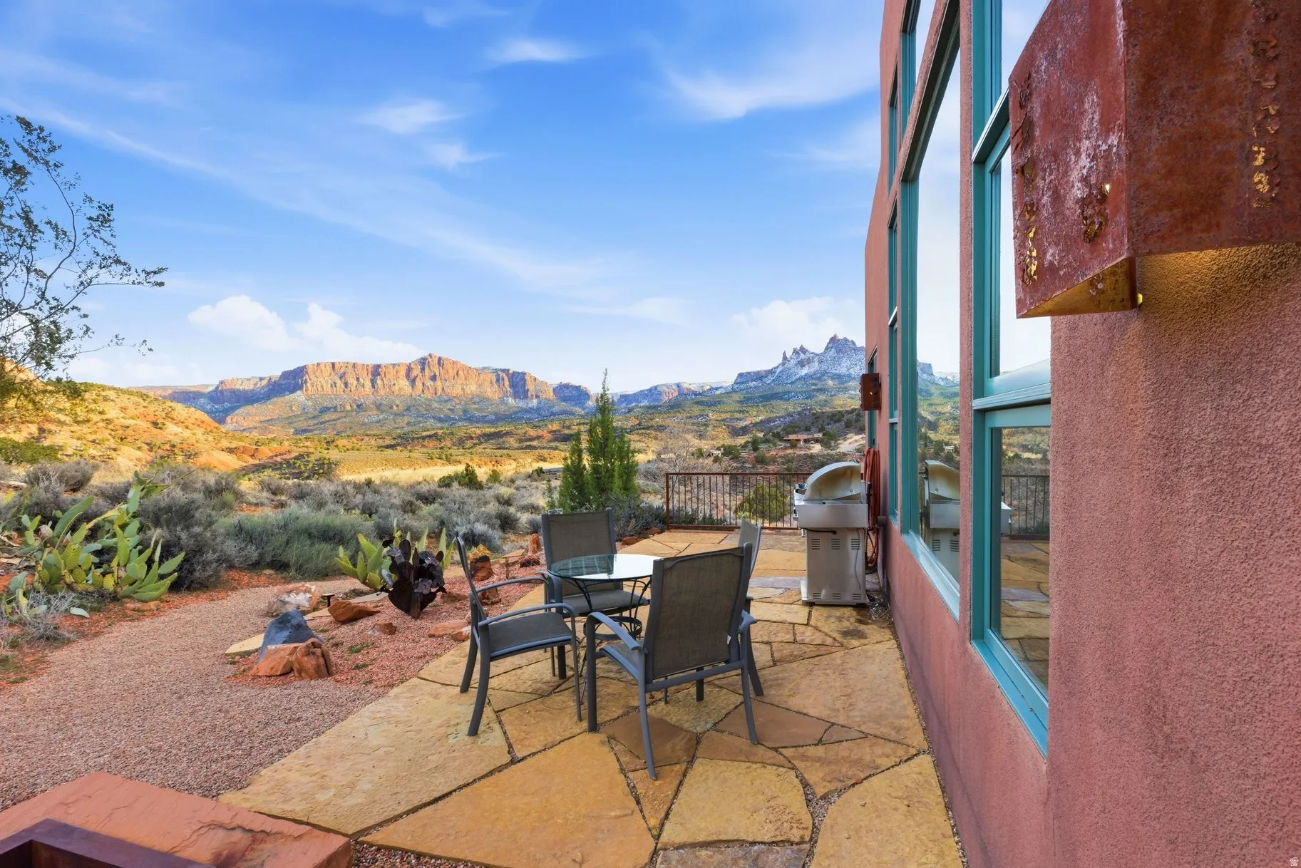 View of patio featuring outdoor dining space, a mountain view, and grilling area