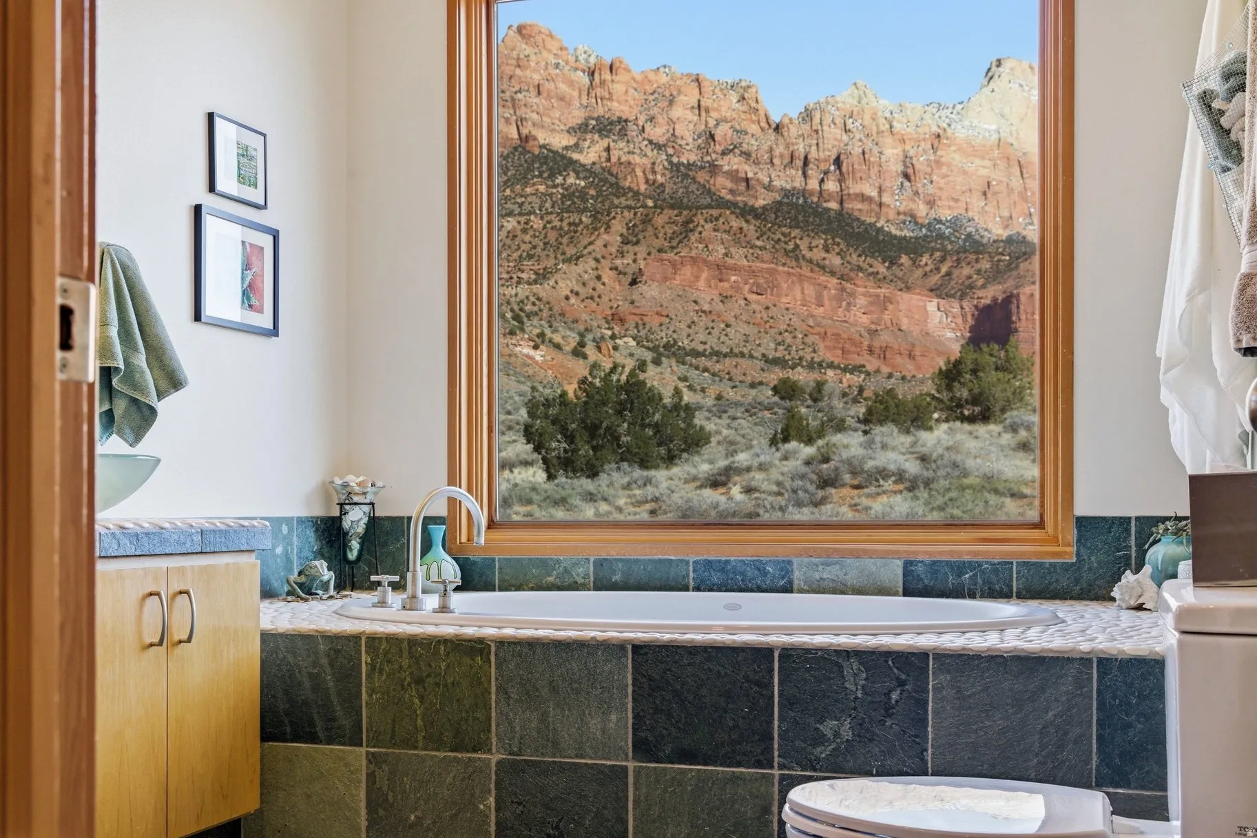 Bathroom featuring vanity and a bath