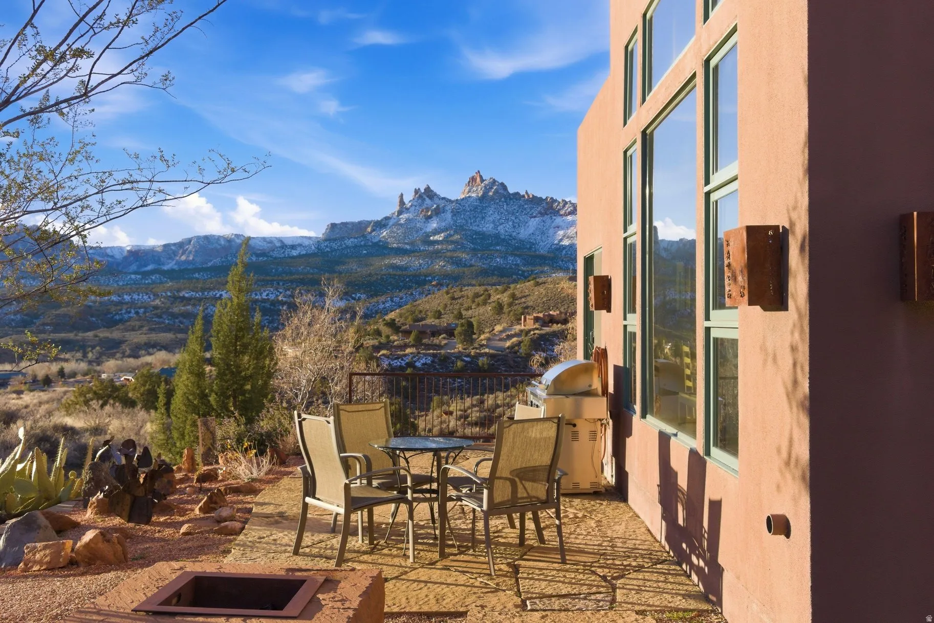 View of patio featuring a mountain view, outdoor dining area, and grilling area