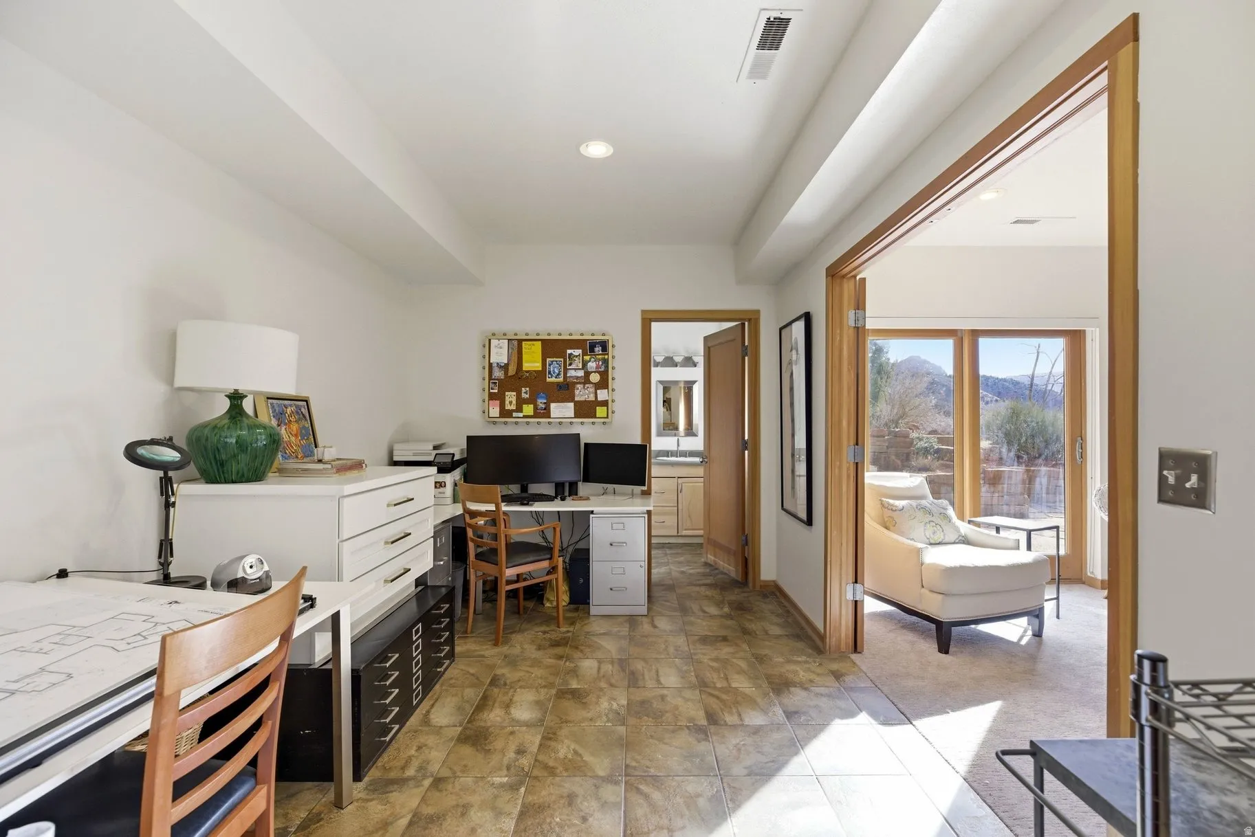 Home office featuring recessed lighting and stone finish floors