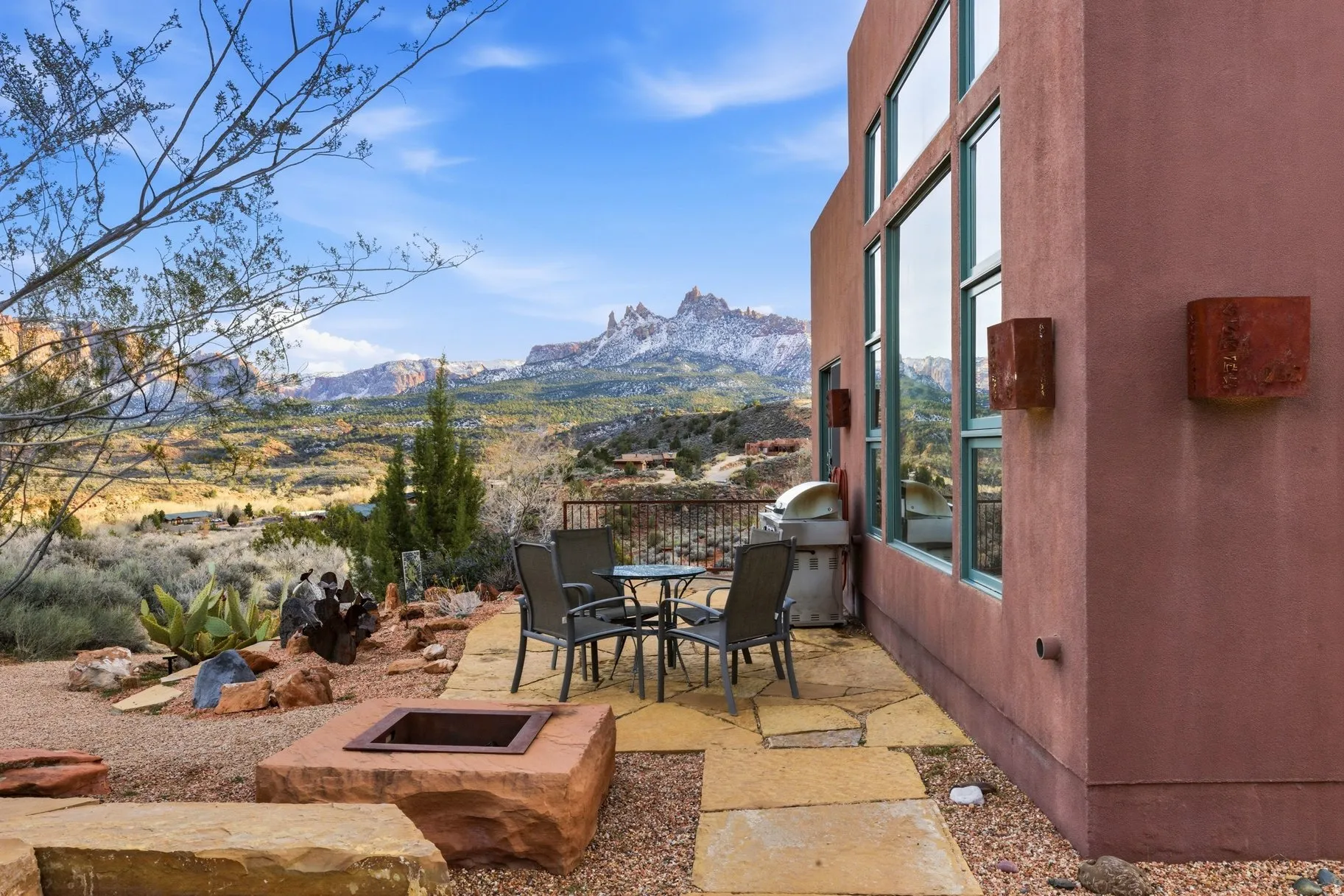 View of patio / terrace with an outdoor fire pit, a mountain view, outdoor dining area, and area for grilling