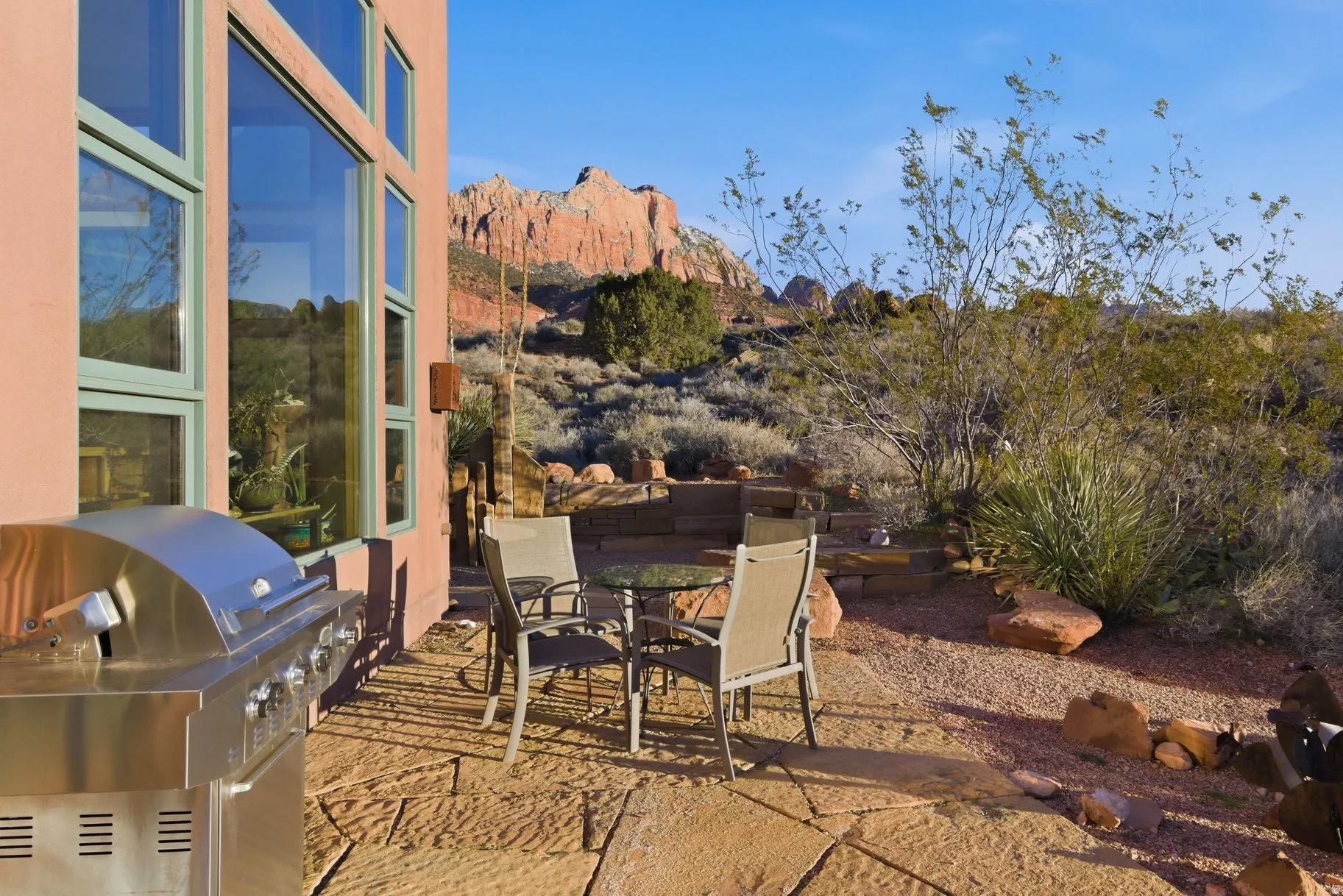 View of patio / terrace with a grill, outdoor dining space, and a mountain view