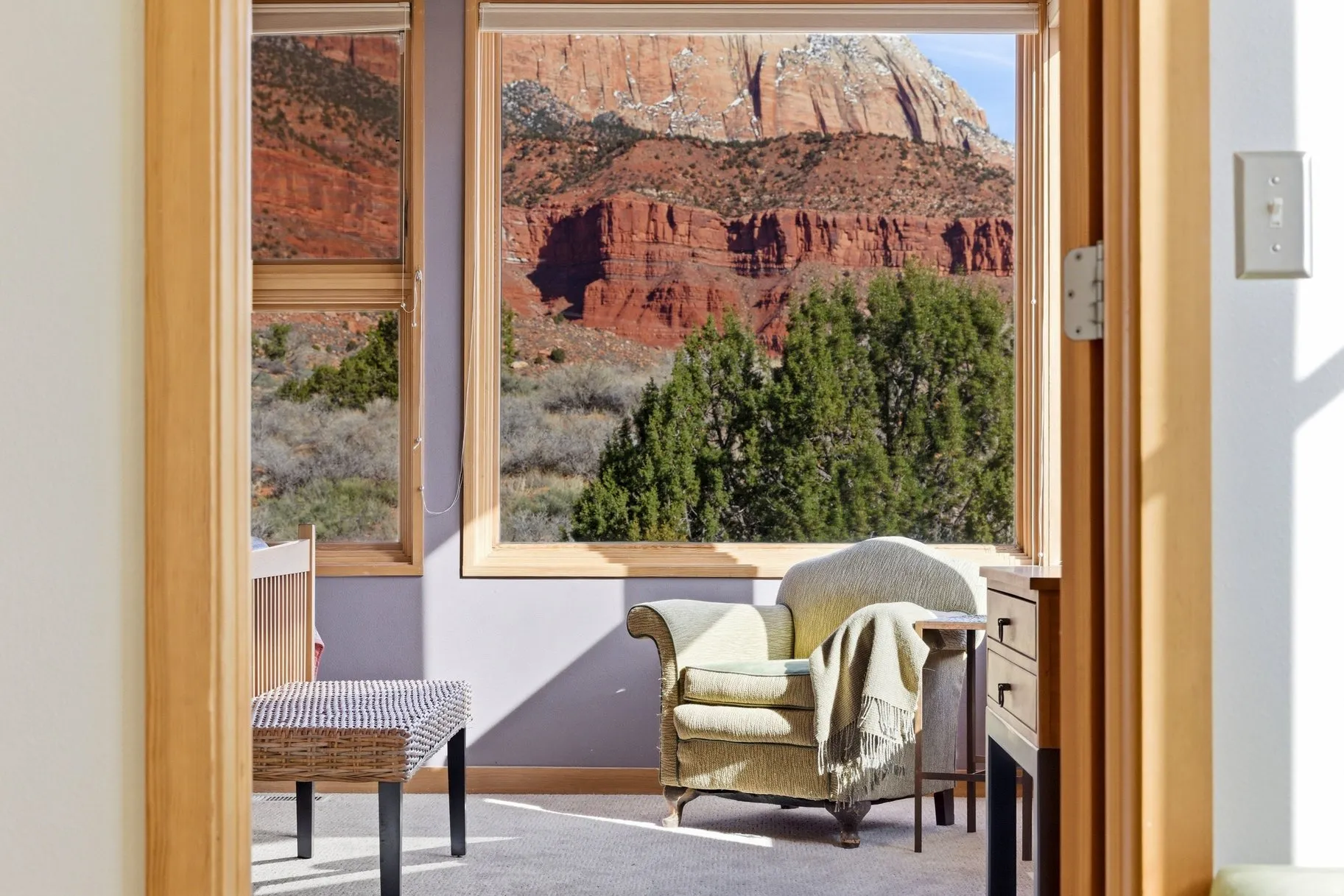 Living area featuring carpet floors and baseboards