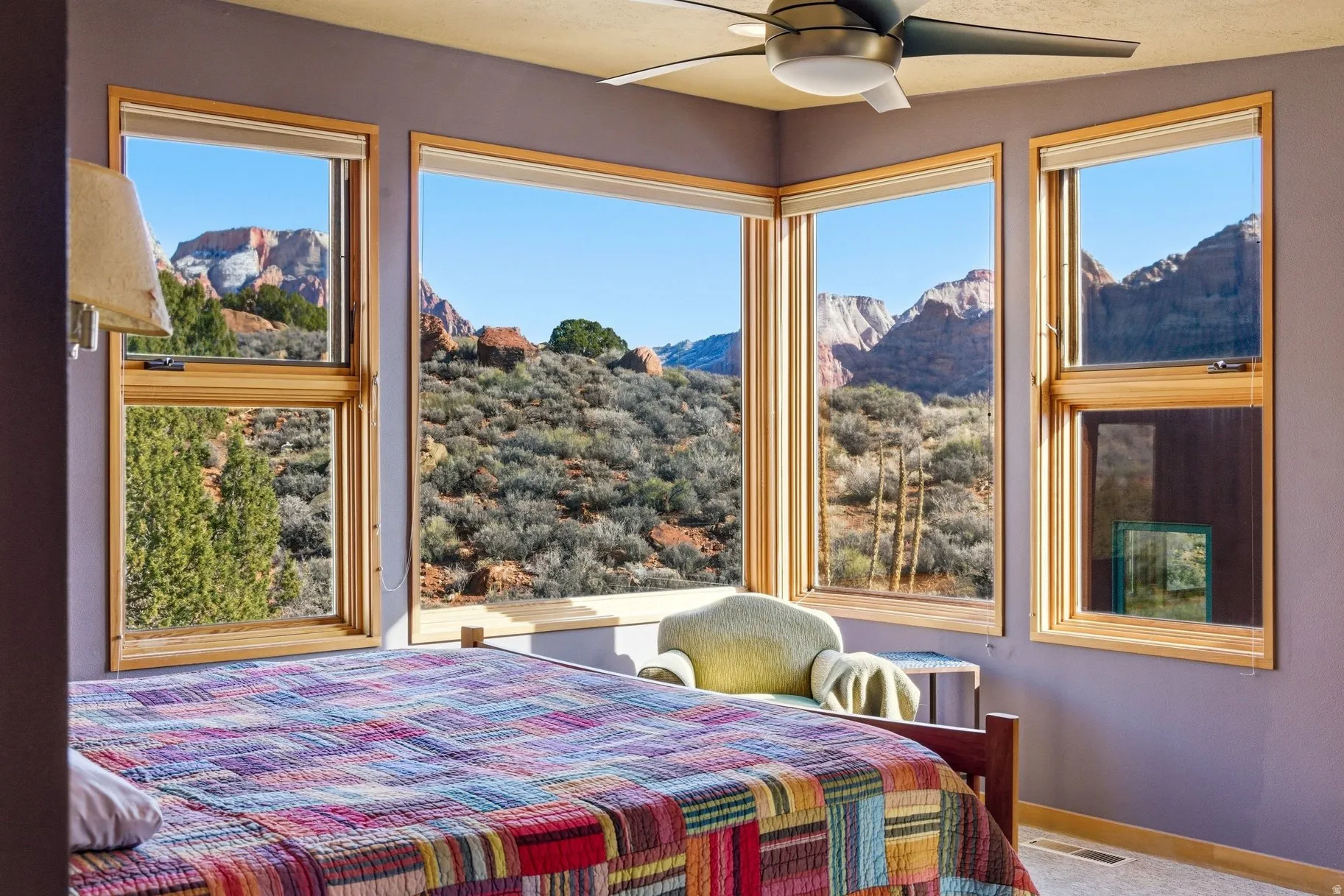 Bedroom with a mountain view and a ceiling fan