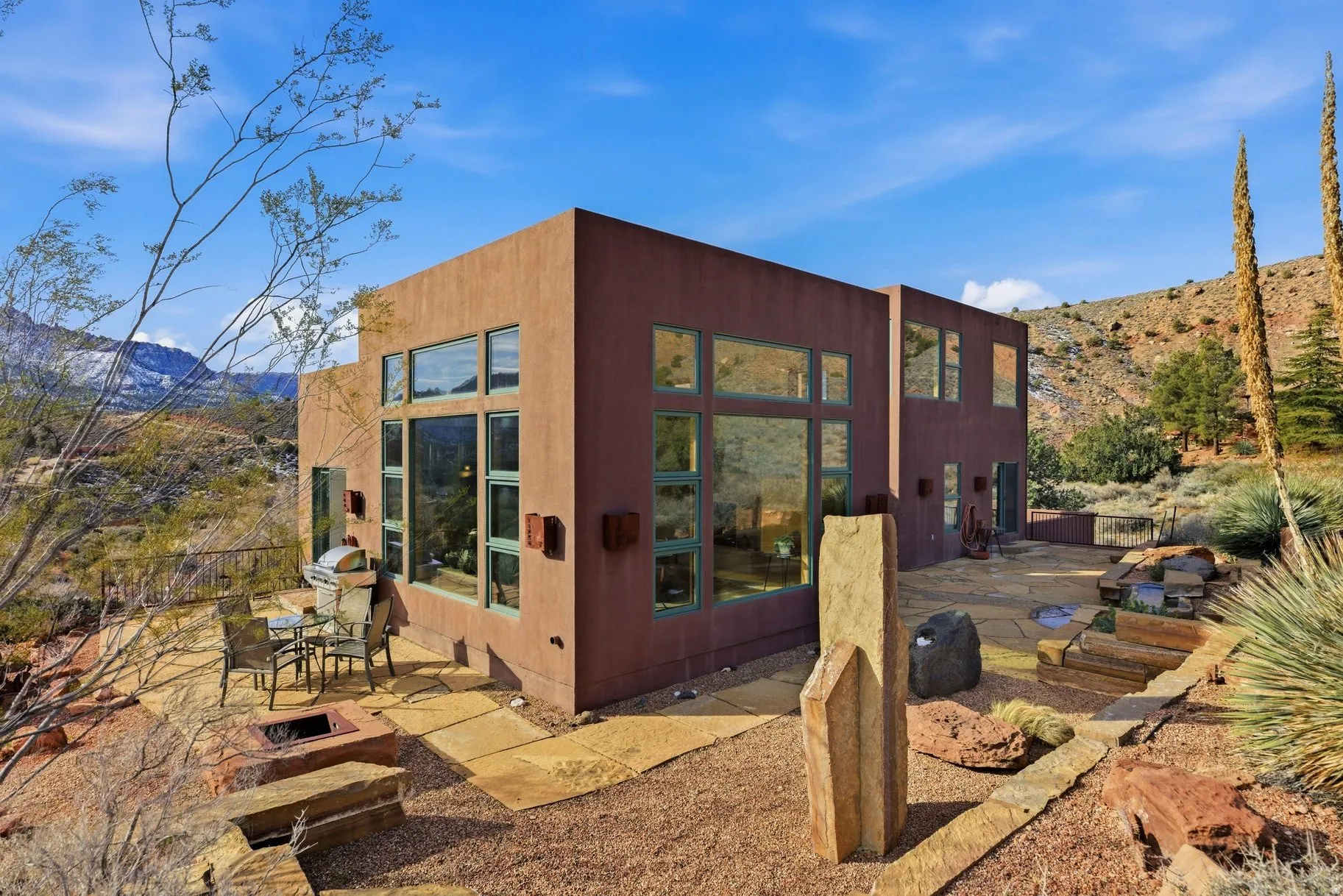 Rear view of house with a mountain view and a patio