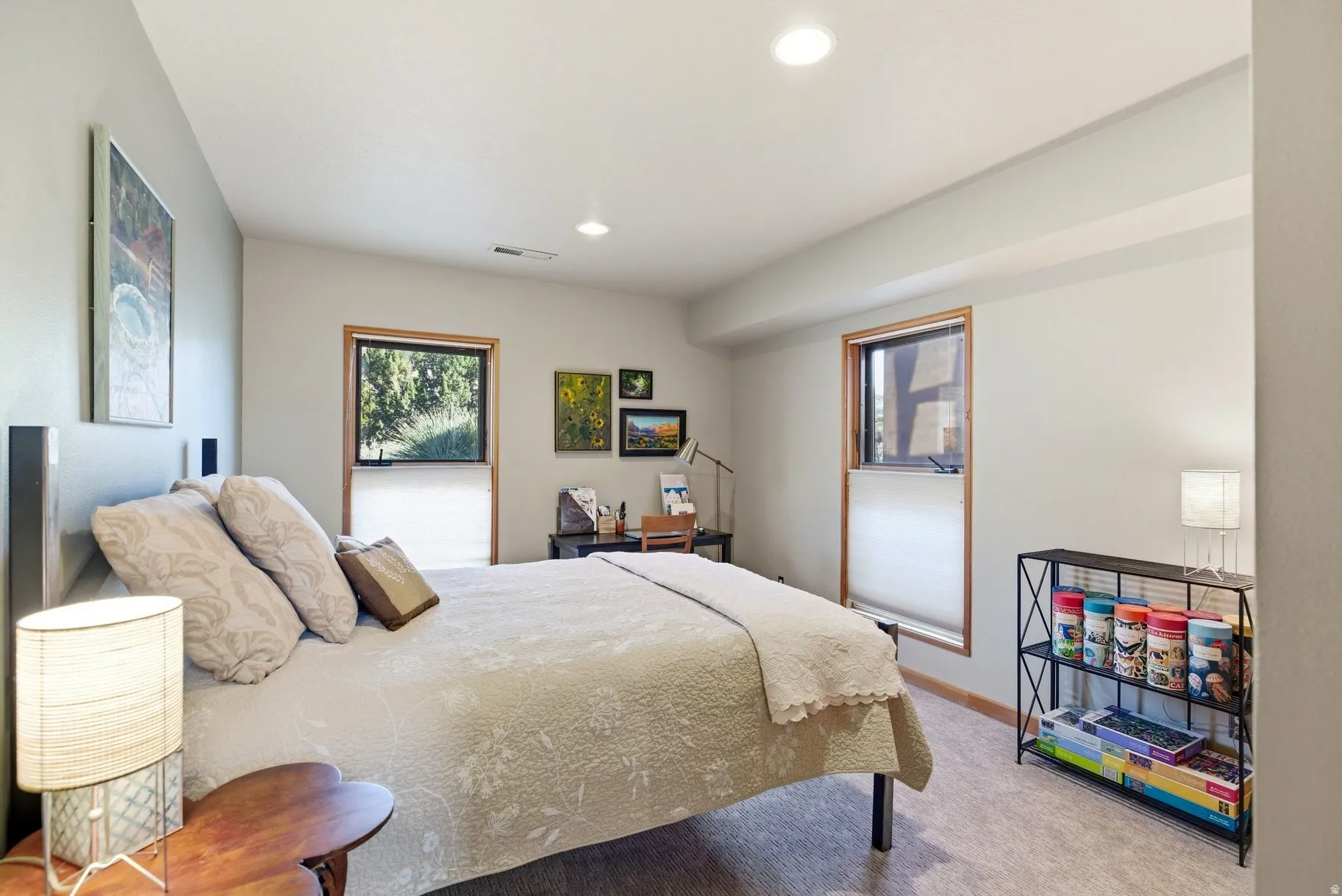 Bedroom with light colored carpet and recessed lighting