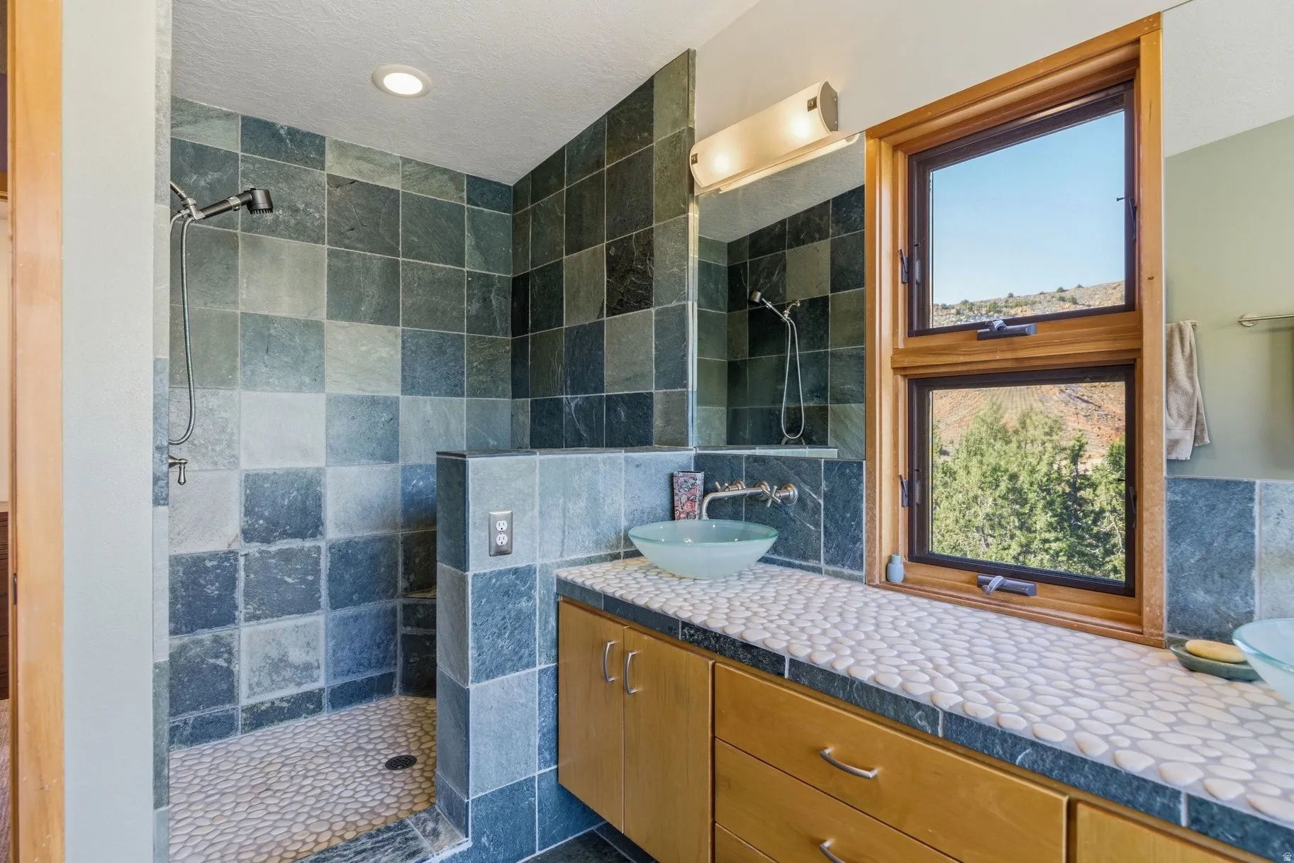 Full bath with vanity and a walk in shower