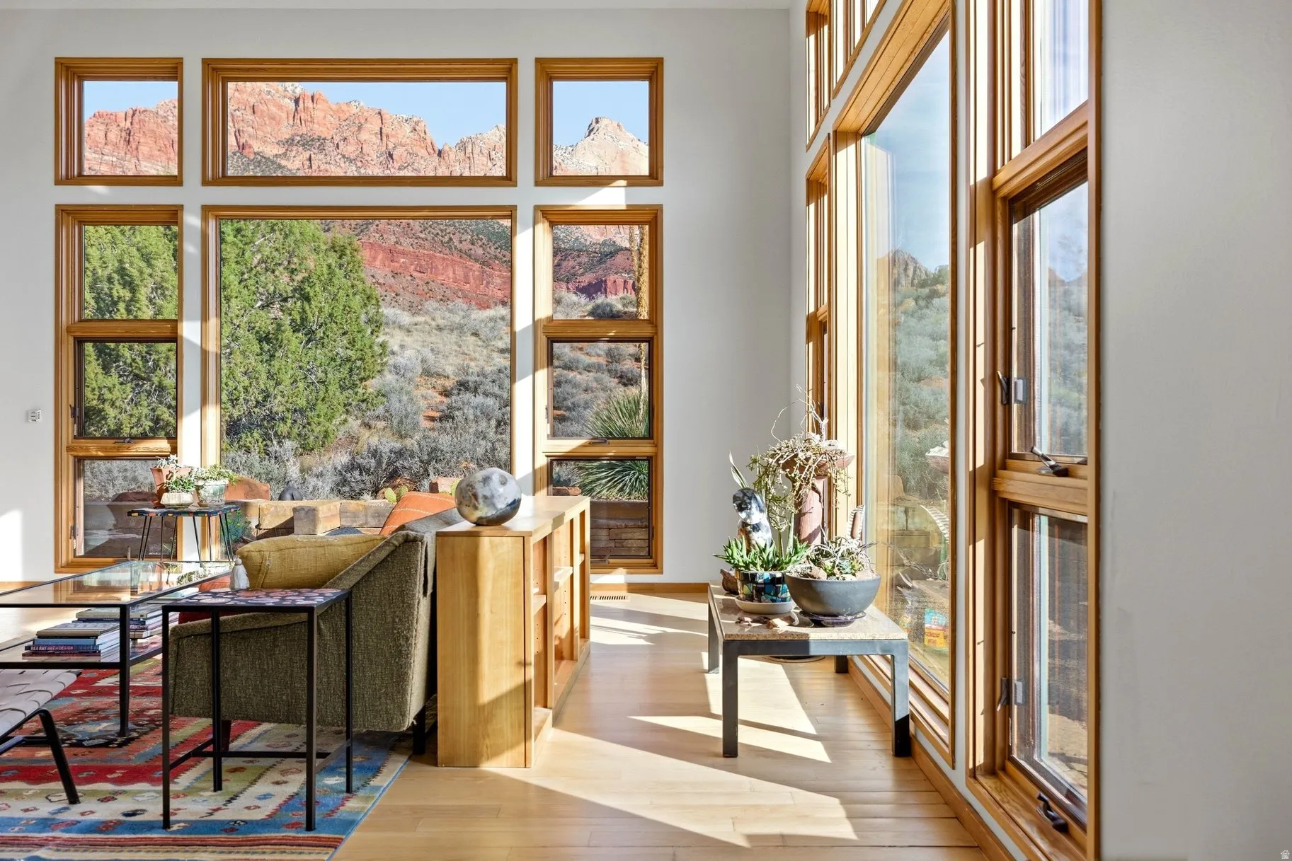 Sitting room featuring healthy amount of natural light and light wood-style floors