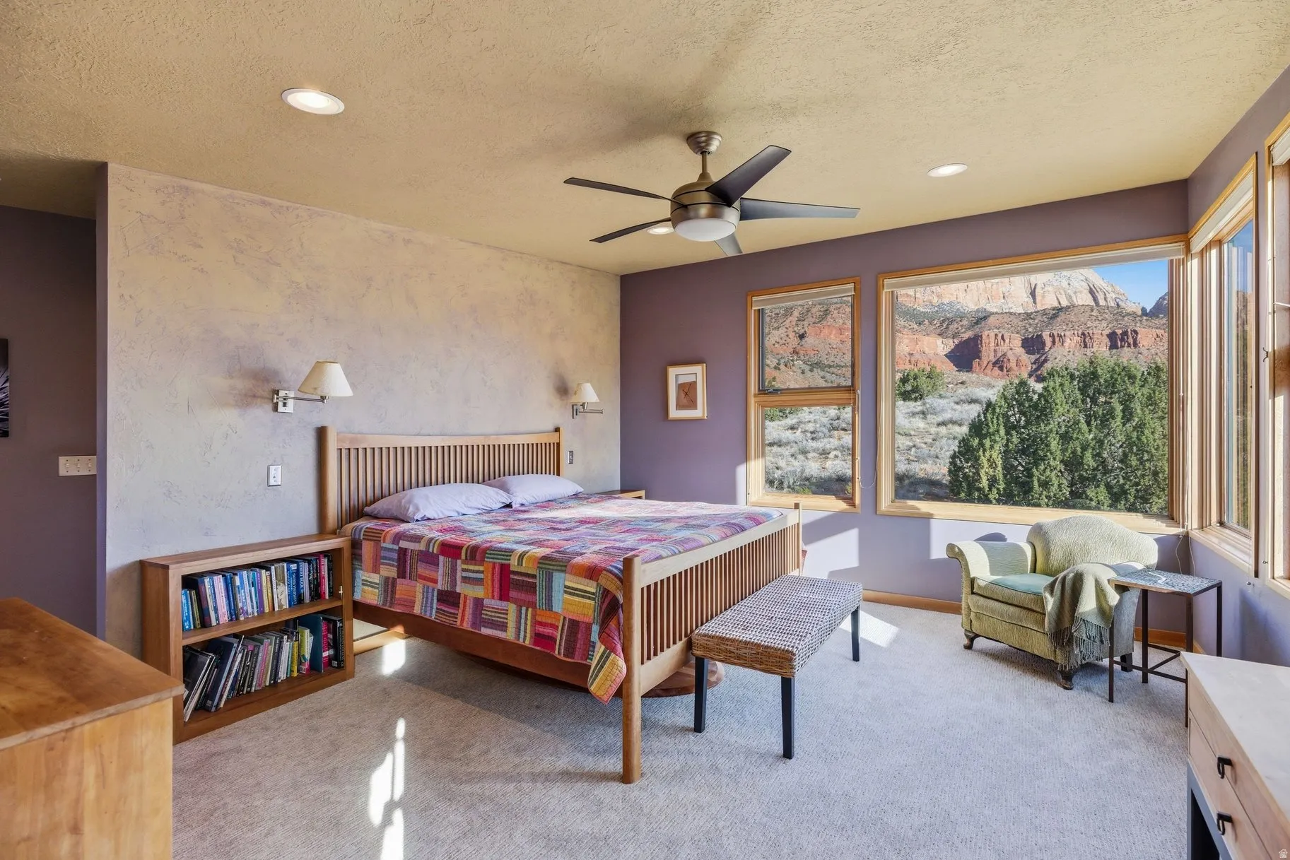 Bedroom featuring a textured ceiling, recessed lighting, light colored carpet, and ceiling fan