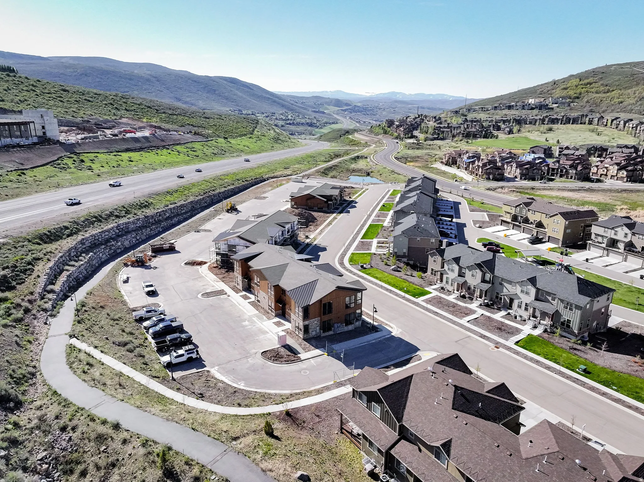 Aerial perspective of suburban area featuring a mountainous background