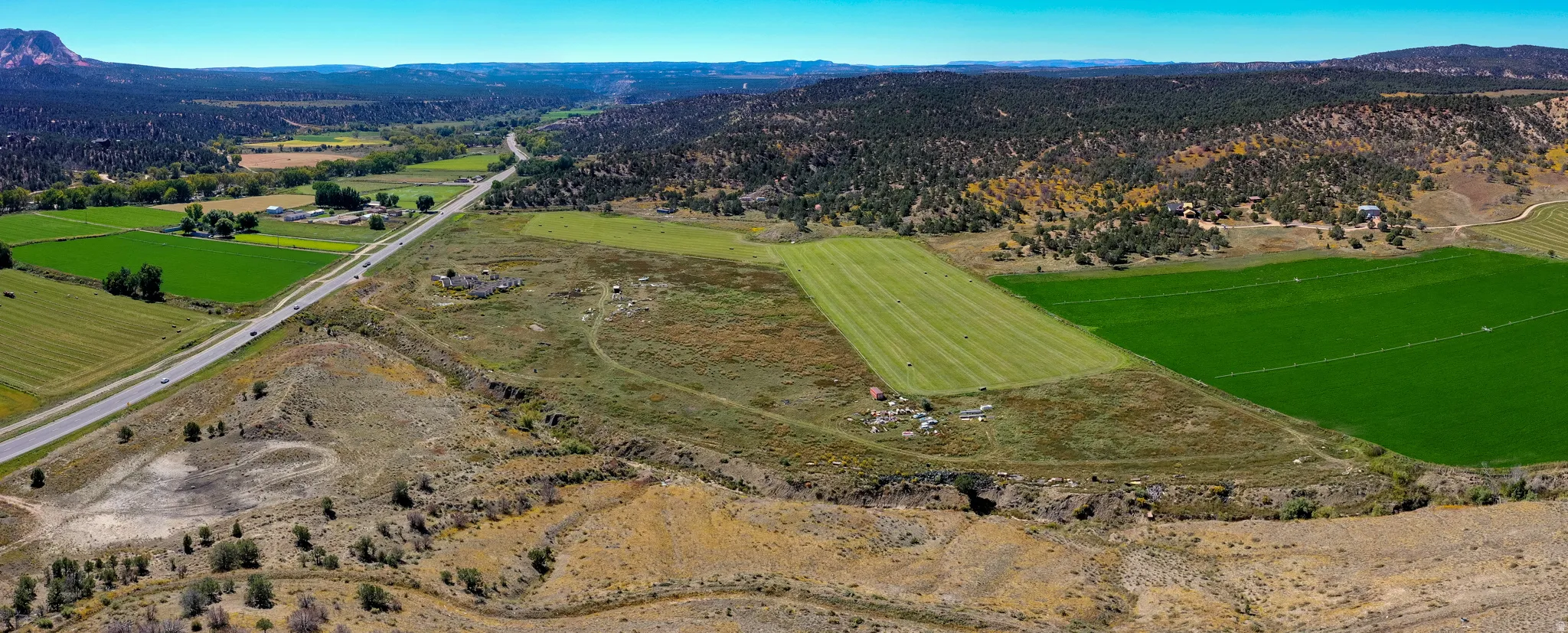Overview of rural landscape featuring a mountain backdrop