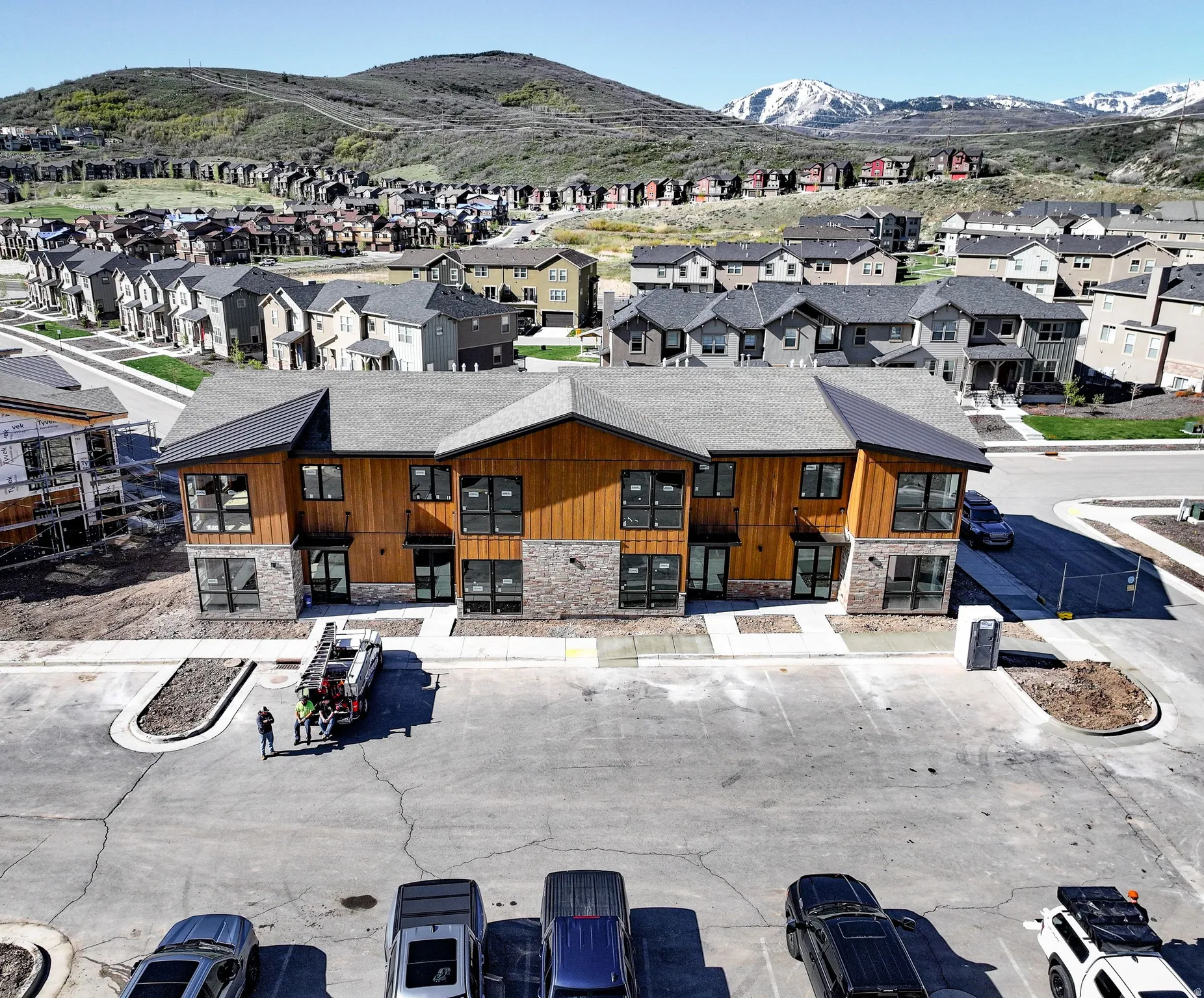 View of property featuring a mountain view and uncovered parking
