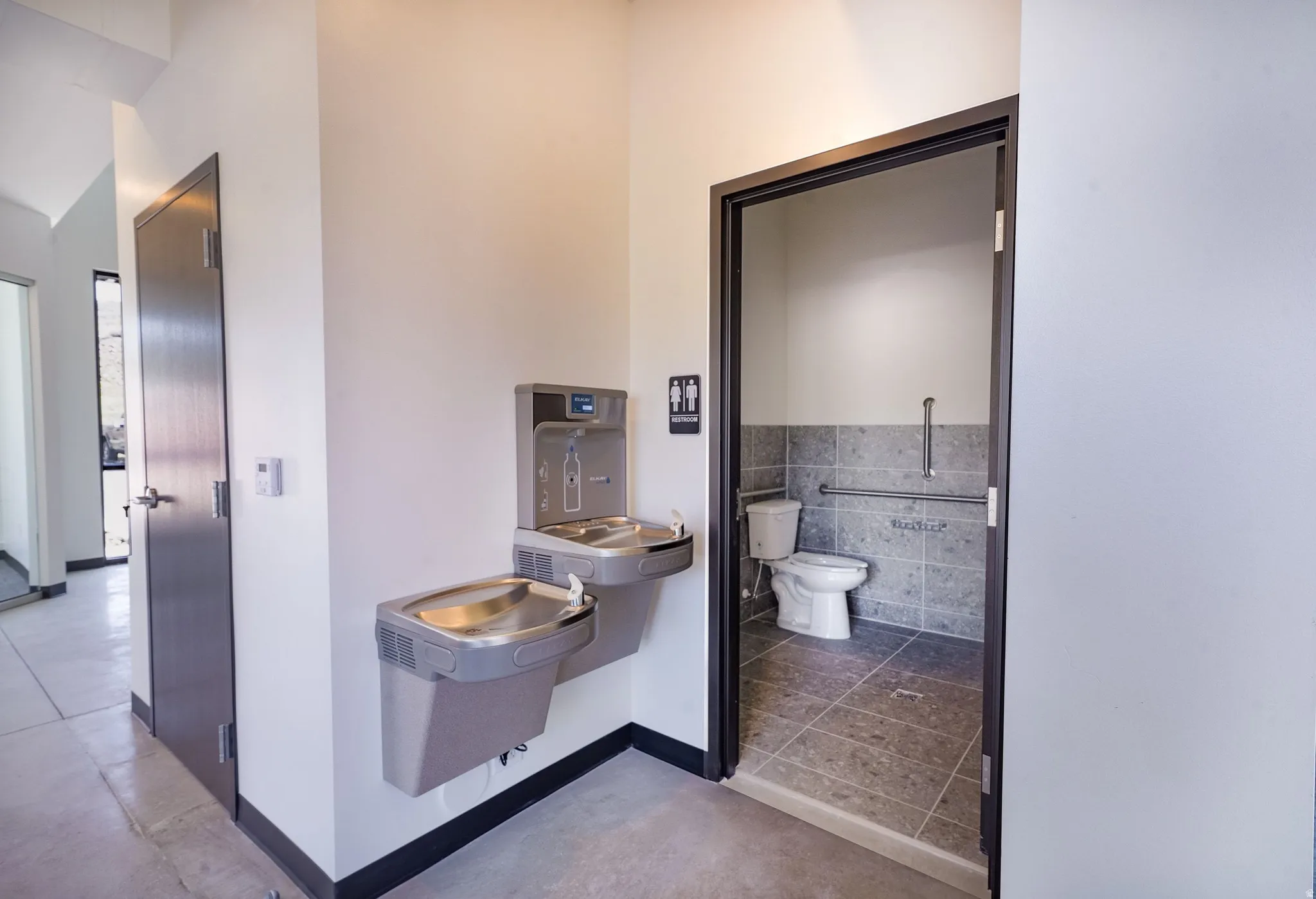 Bathroom with toilet and baseboards