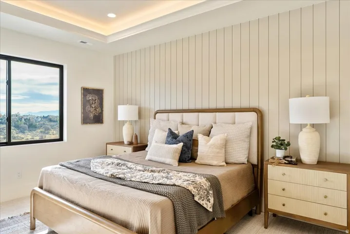 Bedroom featuring carpet flooring, wooden walls, and recessed lighting