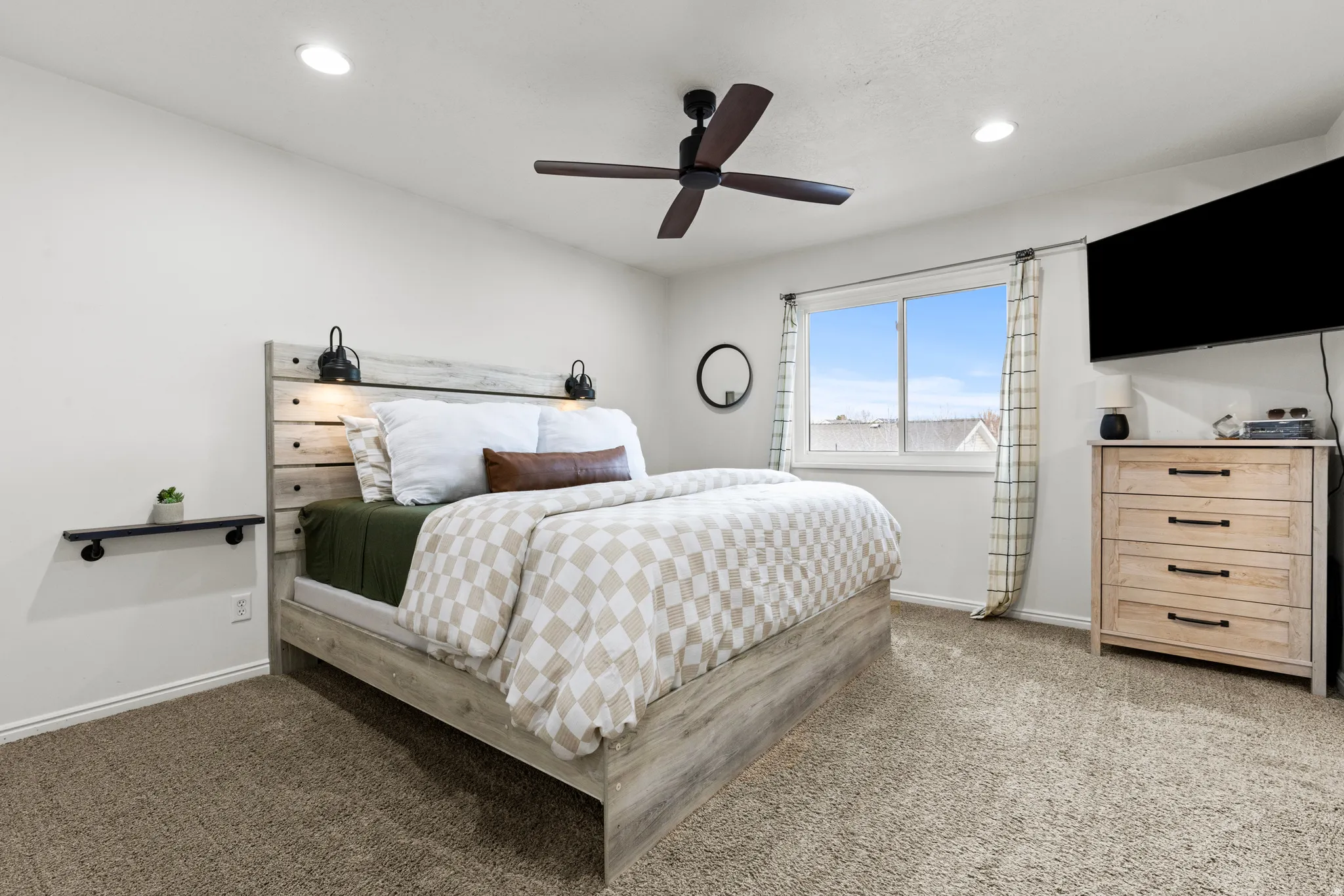 Bedroom featuring ceiling fan, light carpet, and recessed lighting