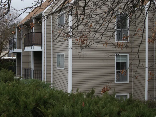 View of side of home with a balcony