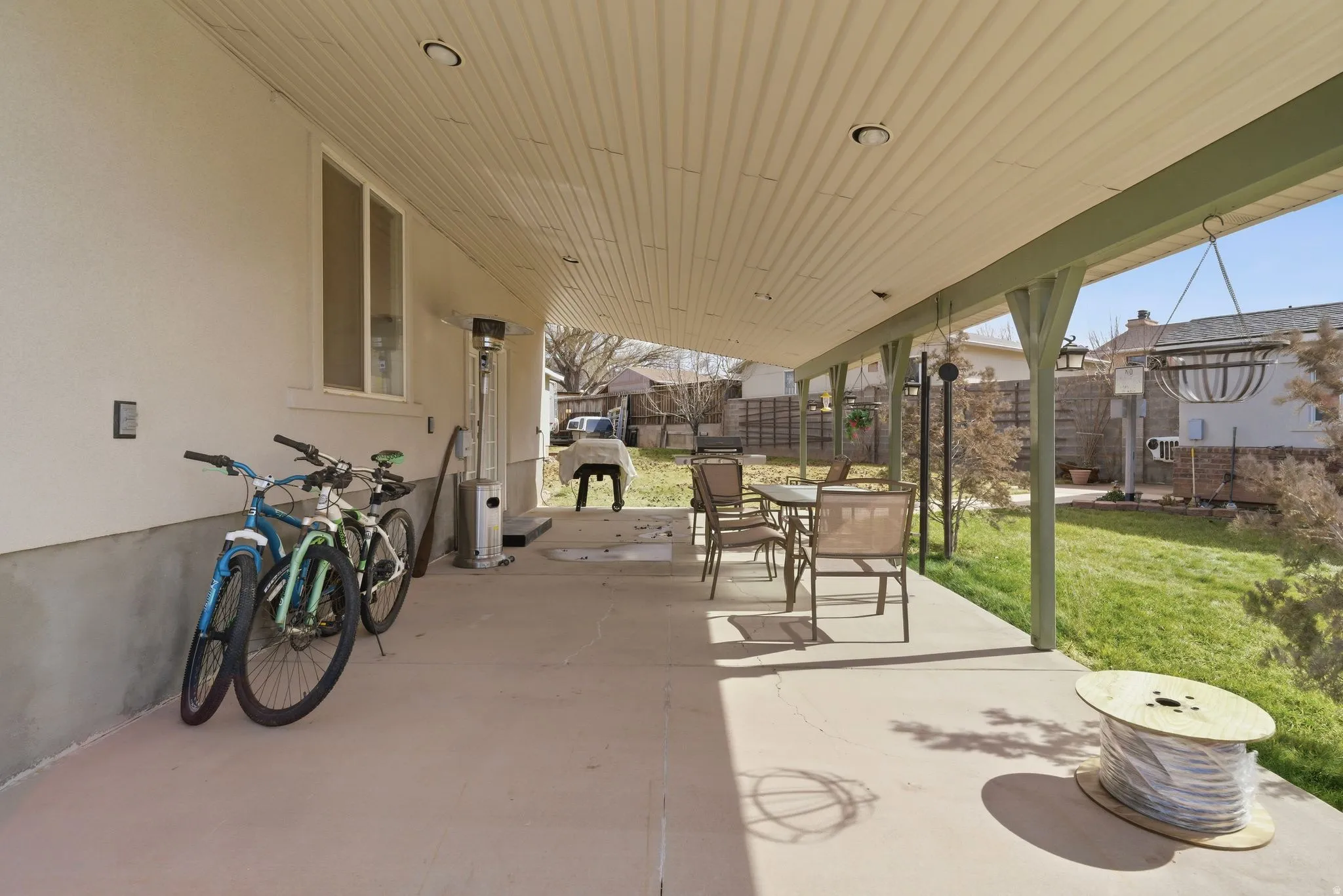 Fenced backyard featuring a patio and outdoor dining space