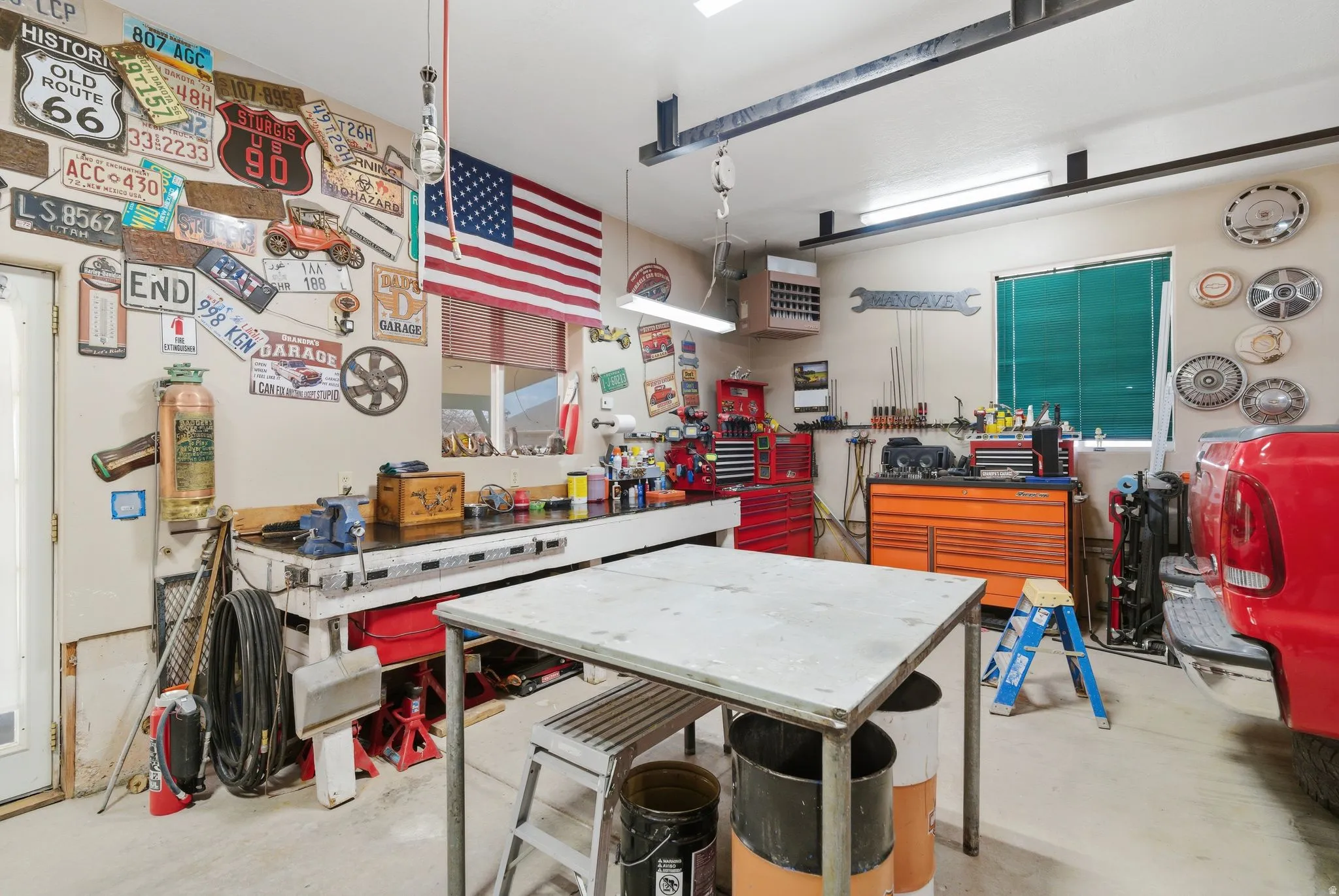 Garage with a workshop area and a heating unit