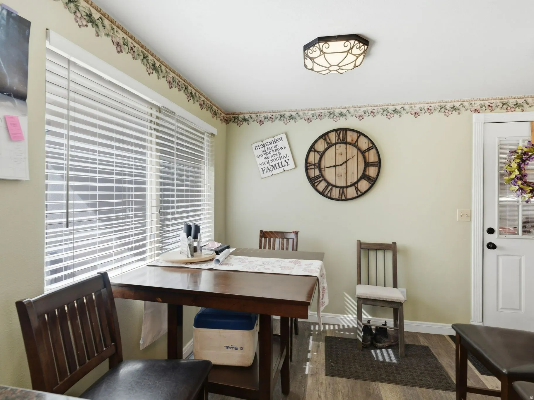 Dining room with wood finished floors and baseboards
