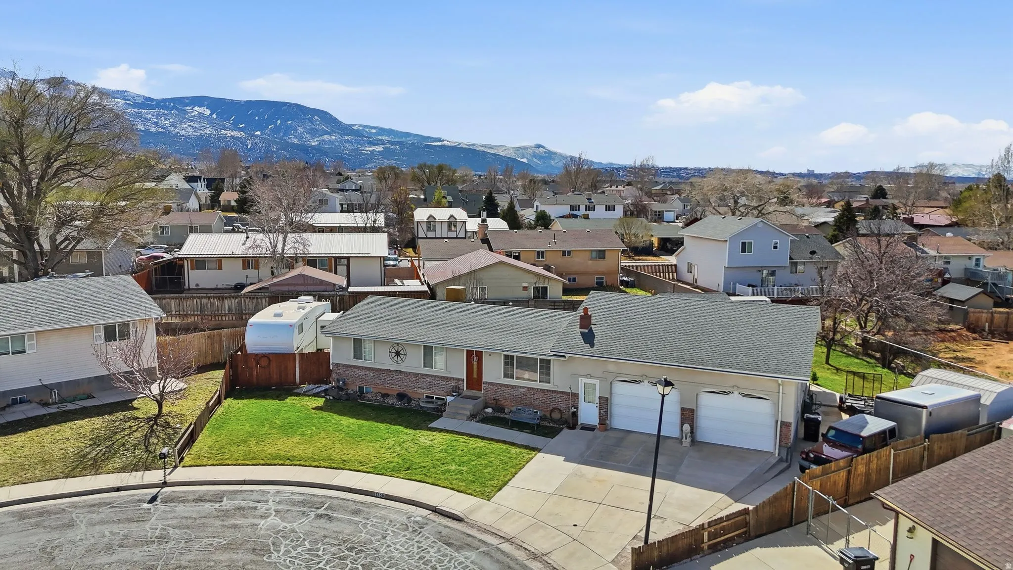 Aerial perspective of suburban area featuring mountains