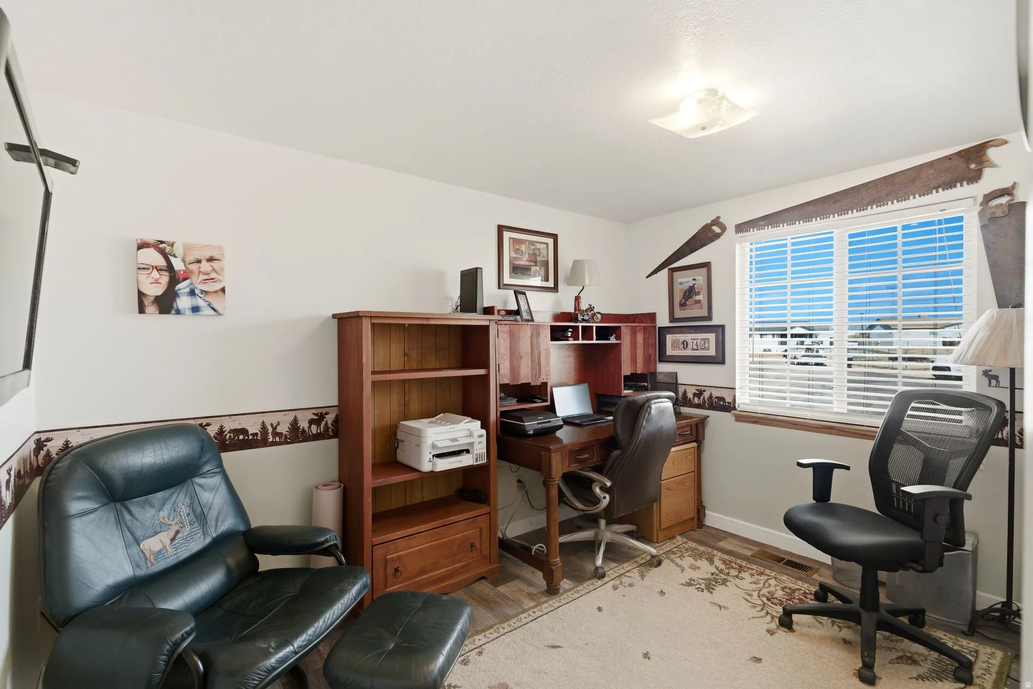 Office featuring light wood-type flooring and baseboards