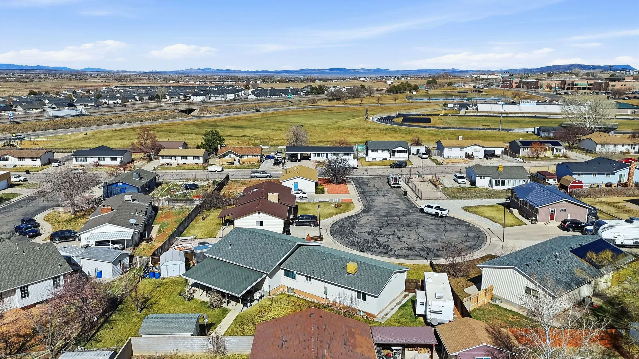 Aerial perspective of suburban area with mountains