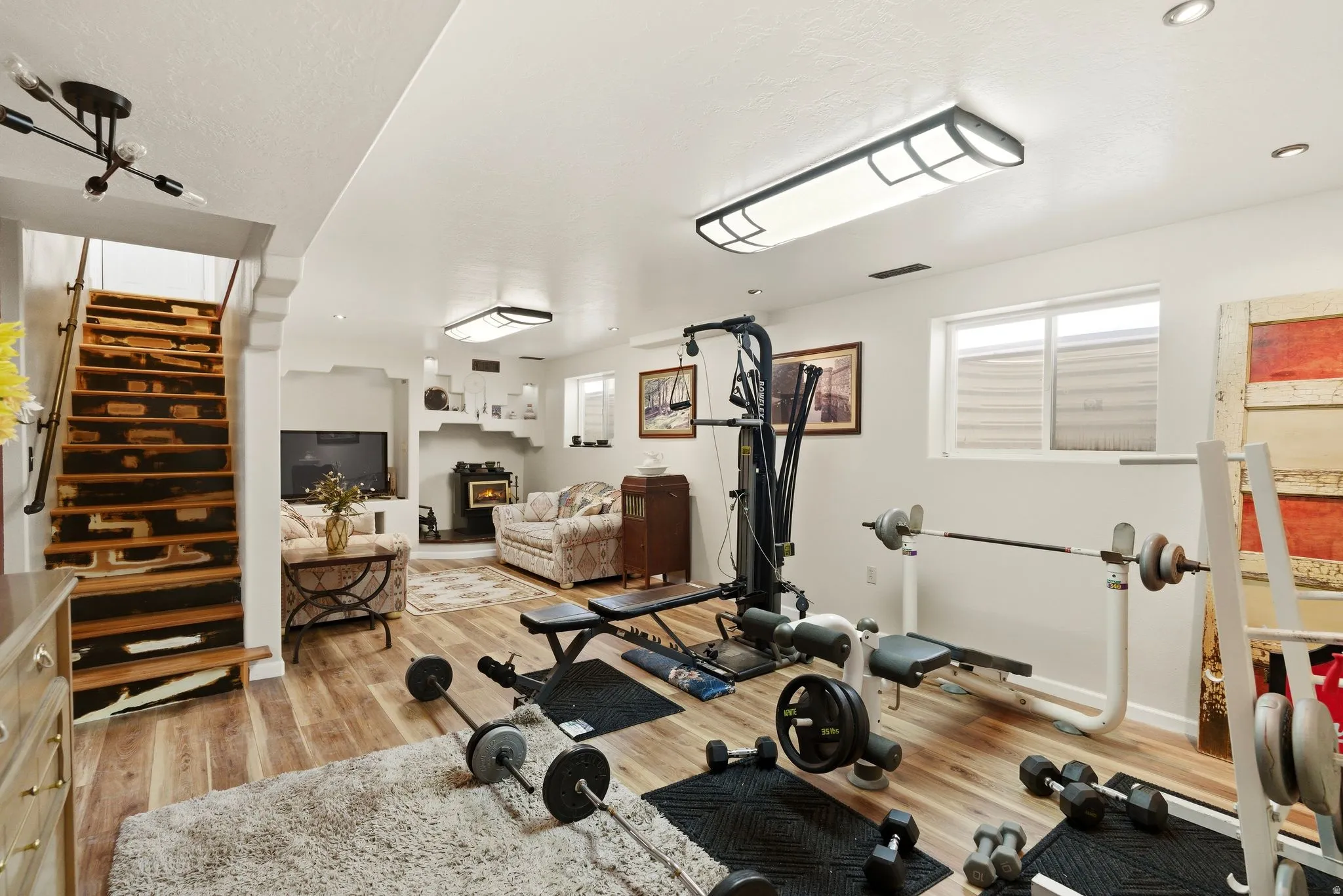 Exercise room featuring light wood-style flooring
