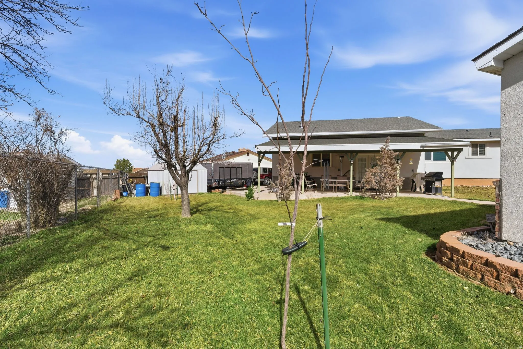 Fenced yard featuring a patio