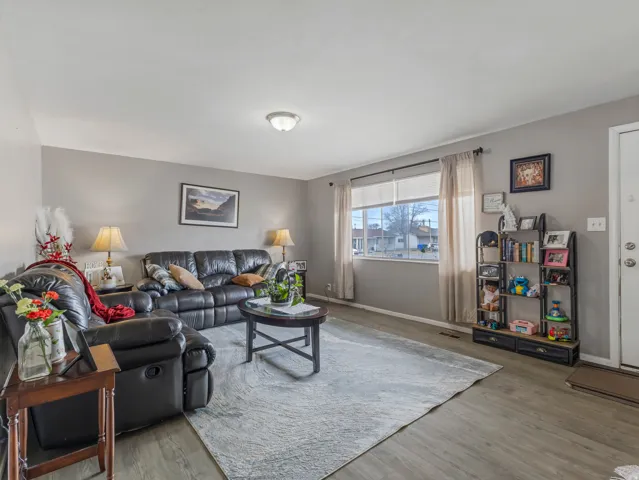 Living room with wood finished floors and baseboards