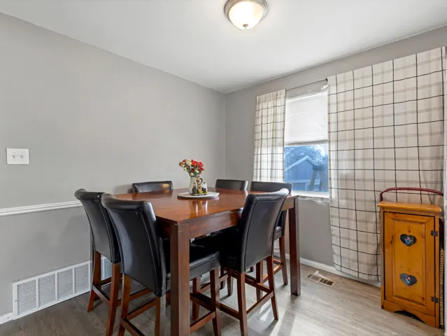 Dining space featuring wood finished floors