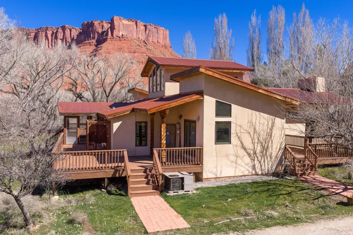 West side of home with view of Parriott mesa