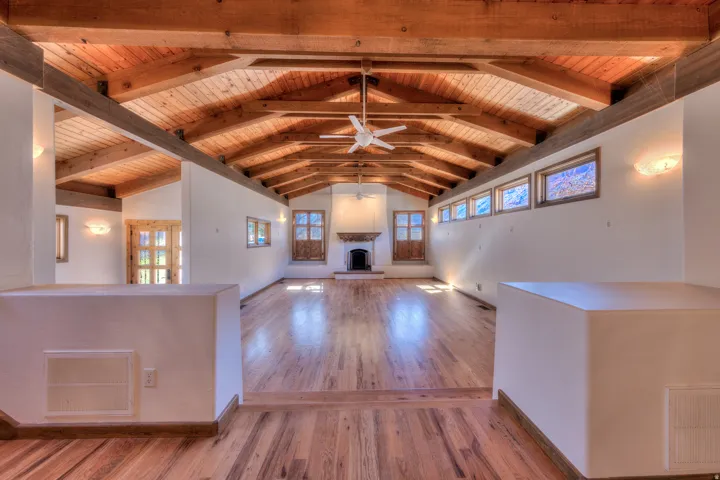 Looking from formal dining area down to living room