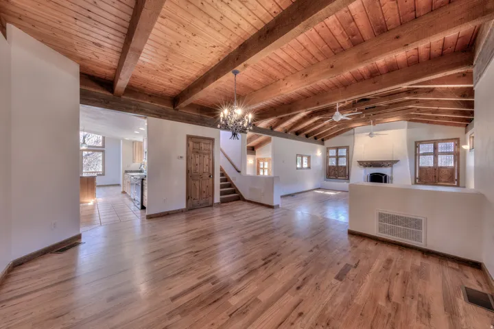 Grand dining space with chandelier looking to kitchen entry
