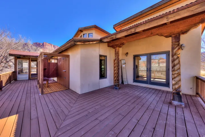 Deck with French doors and  outdoor shower