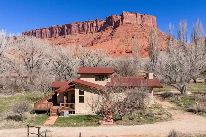 West side of home with view of Parriott mesa