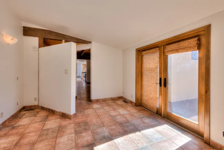 Room from formal dining area with front deck access