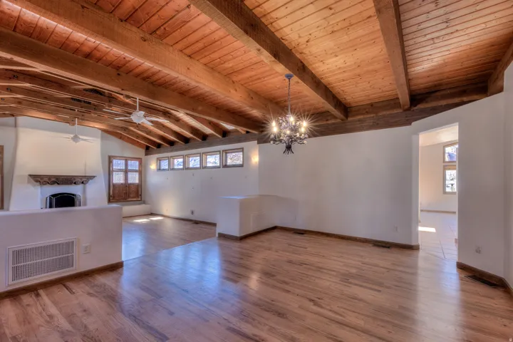 Looking form kitchen entry into formal dining area and living room