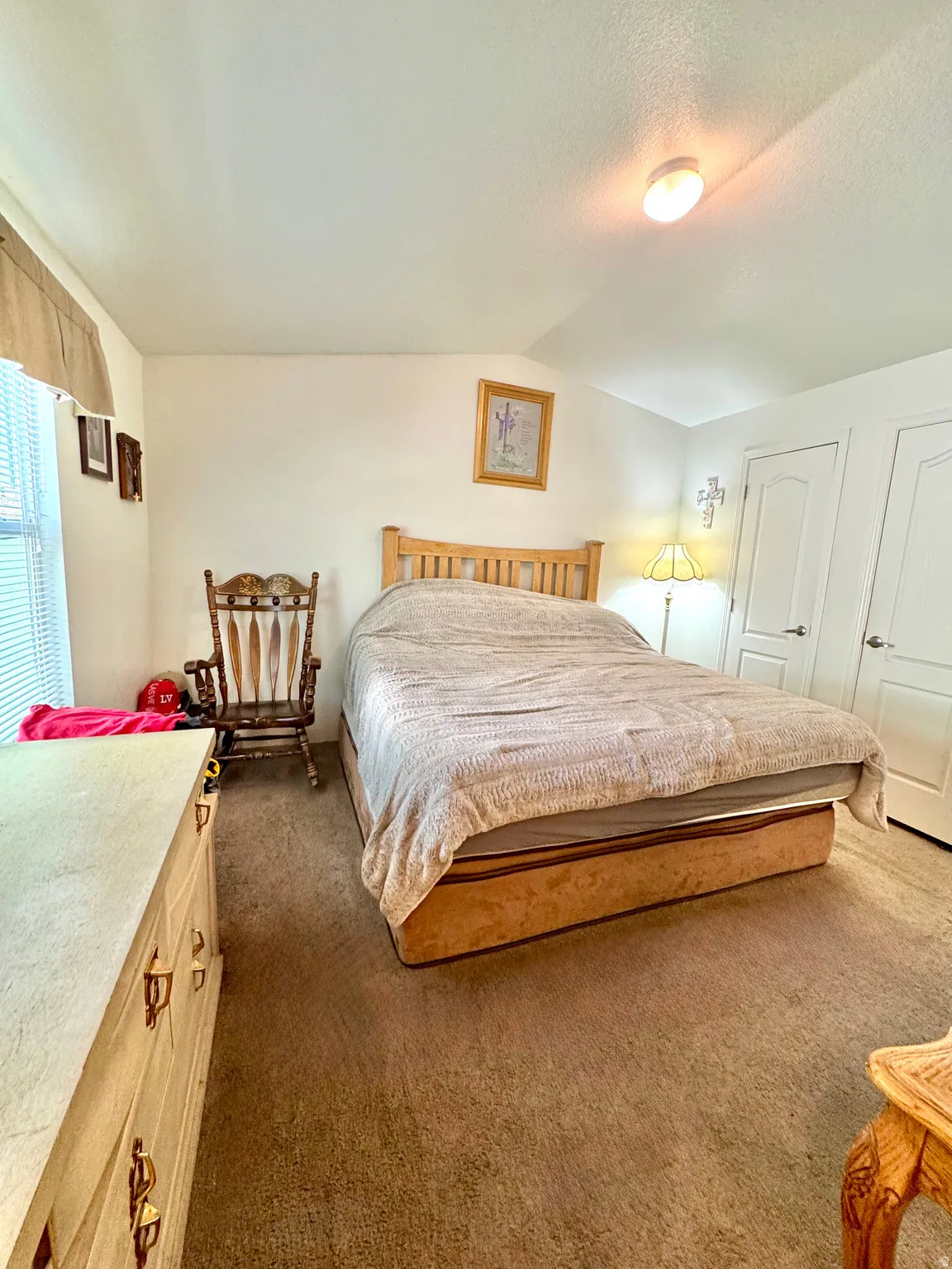 Bedroom with dark carpet
