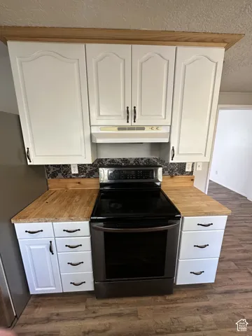 White shaker-style cabinetry with dark hardware