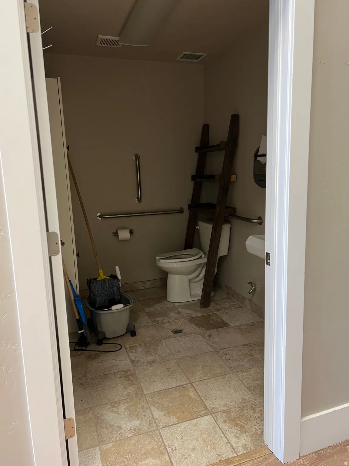 Bathroom featuring toilet and baseboards