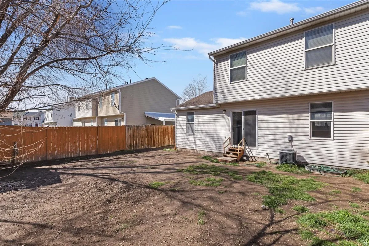Back of house with entry steps