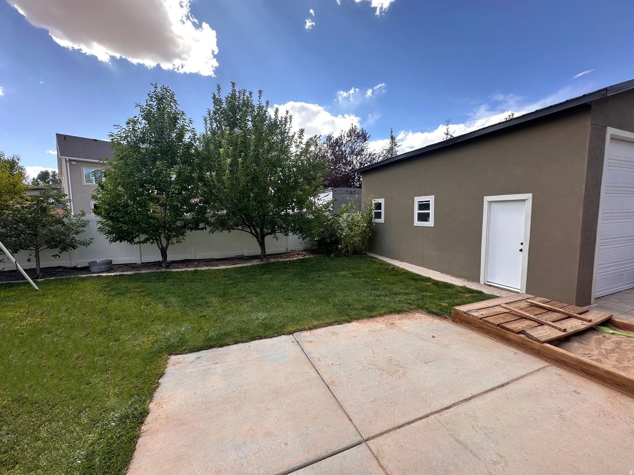 Fenced yard with a patio