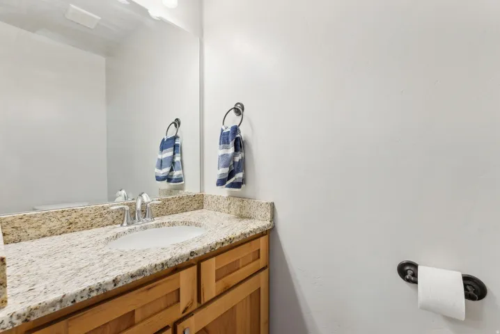 Half bathroom featuring vanity