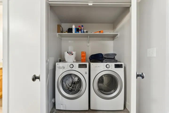 Laundry room with washing machine and dryer