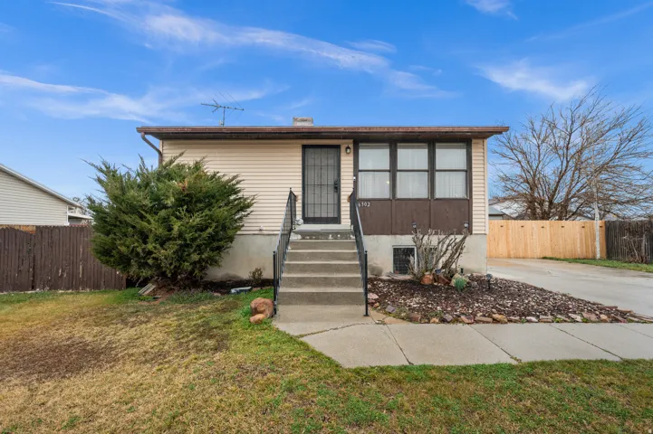 View of front of home featuring a chimney